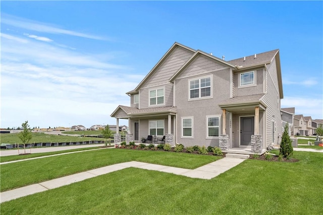 craftsman inspired home with a front yard