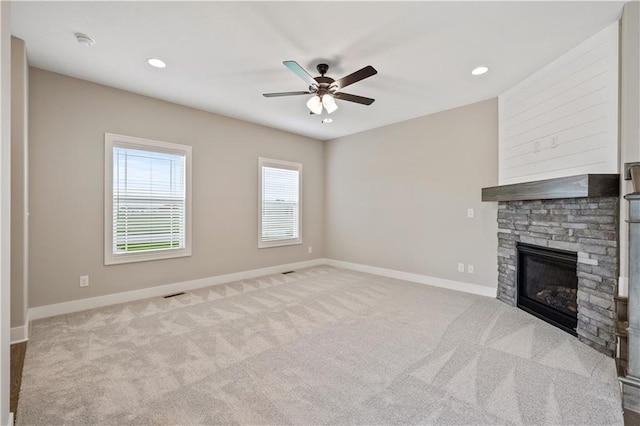 16993 W 164th Ter, Olathe, KS 66062 - unfurnished living room with a ceiling fan, carpet floors, a fireplace, baseboards, and recessed lighting