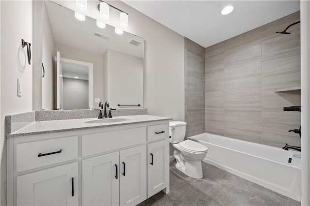 full bathroom with tile patterned floors, toilet, vanity, and tiled shower / bath