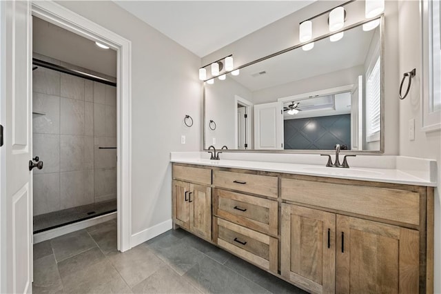 bathroom with ceiling fan, tile patterned flooring, double sink vanity, and an enclosed shower