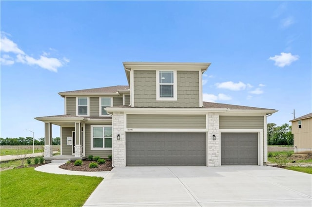 view of front of property featuring stone siding, concrete driveway, and a front lawn