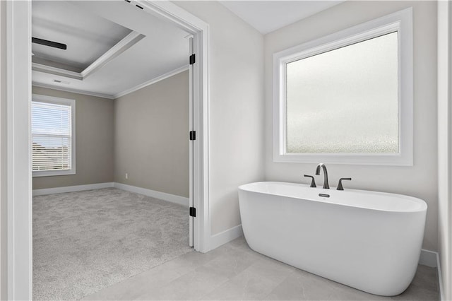 bathroom with tile patterned flooring and crown molding