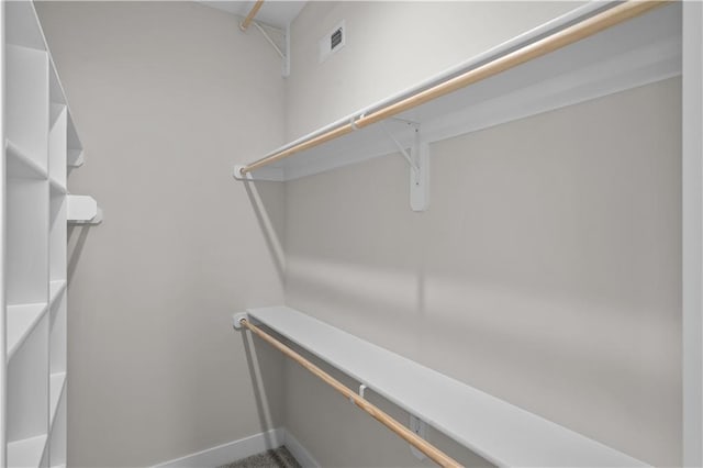 spacious closet featuring visible vents