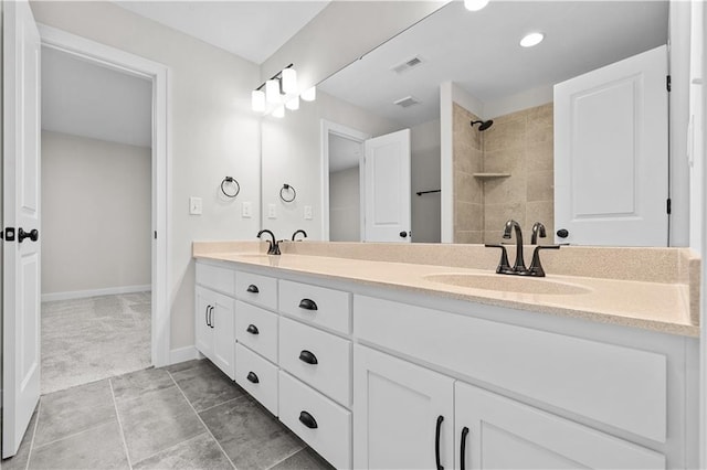 bathroom featuring tile patterned flooring and double sink vanity