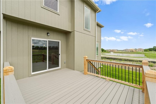 wooden terrace with a yard