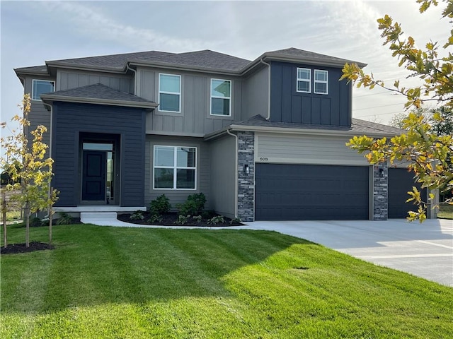 view of front facade featuring a garage and a front lawn