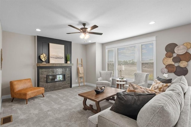 19019 W 169th Pl, Olathe, KS 66062 - living room with visible vents, baseboards, ceiling fan, carpet, and a fireplace