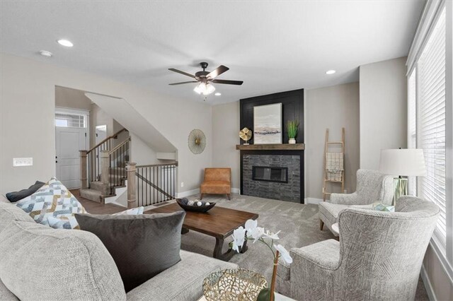 19019 W 169th Pl, Olathe, KS 66062 - living room with carpet, a glass covered fireplace, a ceiling fan, recessed lighting, and stairs