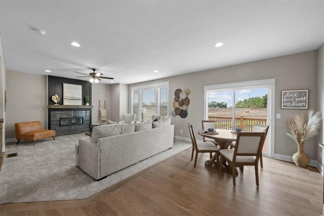 19019 W 169th Pl, Olathe, KS 66062 - living area with wood finished floors, a ceiling fan, and plenty of natural light