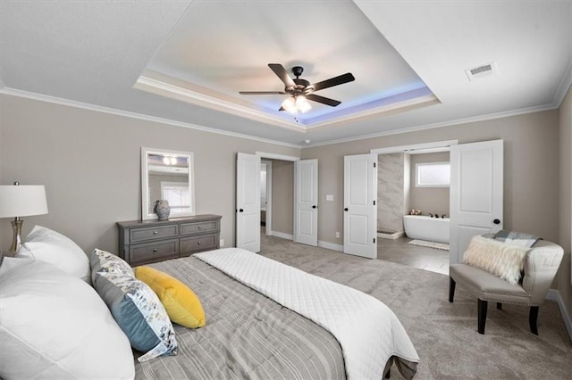 19019 W 169th Pl, Olathe, KS 66062 - bedroom featuring light carpet, a tray ceiling, ornamental molding, and connected bathroom