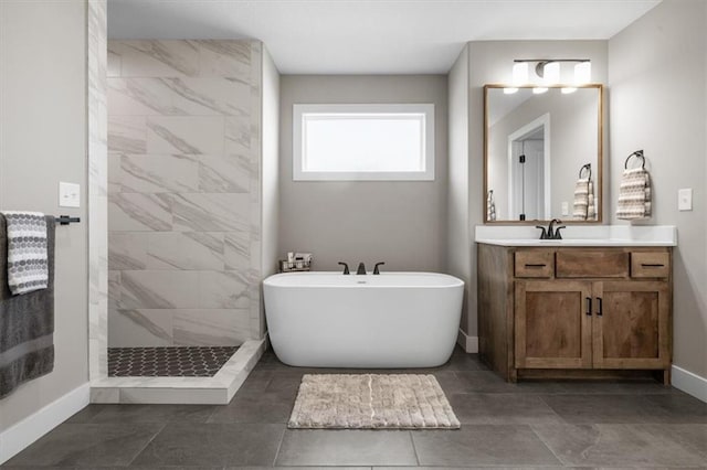 19019 W 169th Pl, Olathe, KS 66062 - full bath featuring a tile shower, a freestanding bath, vanity, and baseboards