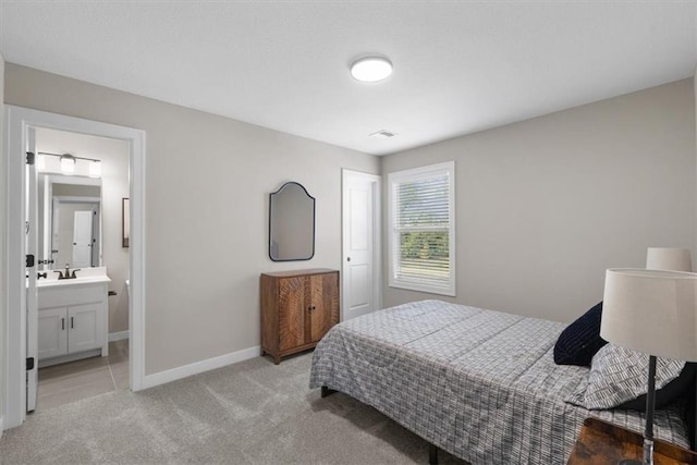 19019 W 169th Pl, Olathe, KS 66062 - bedroom with baseboards, ensuite bath, light colored carpet, and a sink