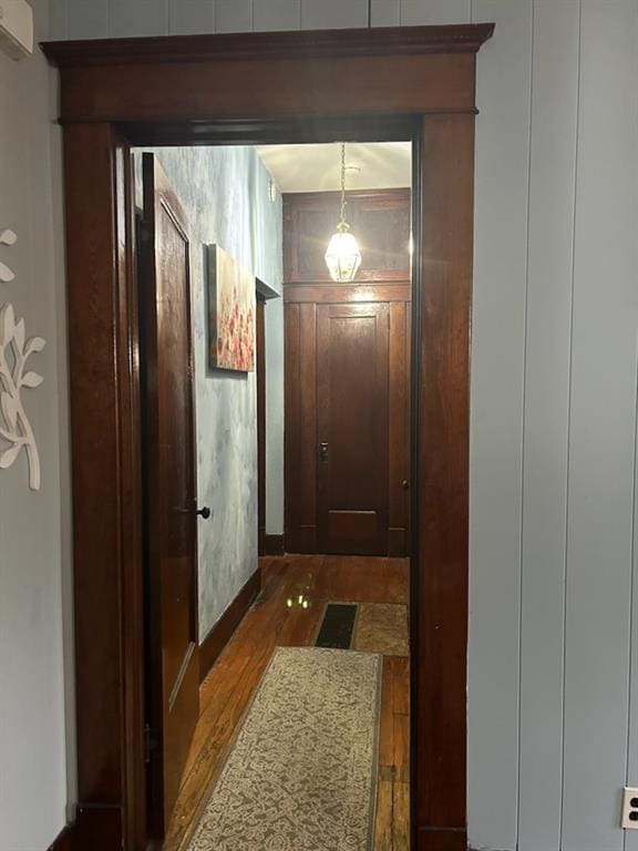 corridor with wood-type flooring