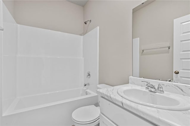 bathroom with  shower combination, vanity, and toilet