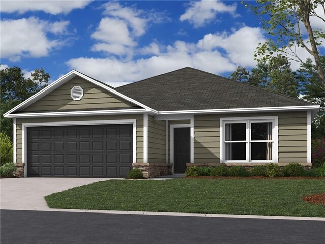 view of front of home with a garage and a front lawn