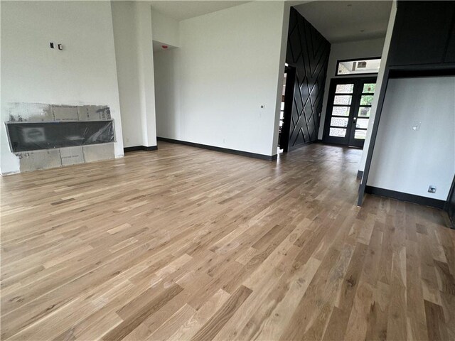 unfurnished living room featuring light hardwood / wood-style floors