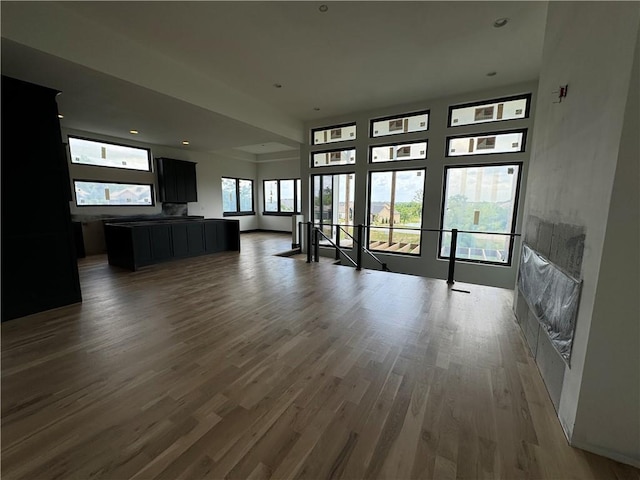 unfurnished living room featuring wood finished floors