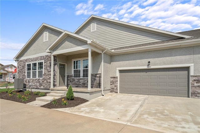 craftsman house with a porch and a garage