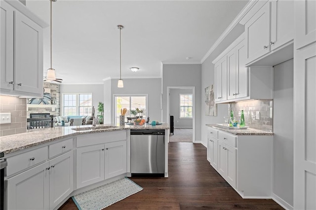 kitchen with backsplash, white cabinetry, stainless steel dishwasher, crown molding, and dark wood-type flooring