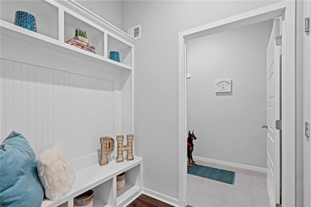 mudroom with light tile patterned floors