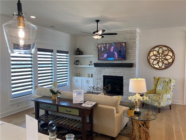 16445 S Elmridge St, Olathe, KS 66062 - living room with ceiling fan, a large fireplace, baseboards, and wood finished floors