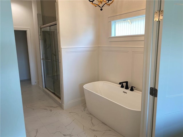 16445 S Elmridge St, Olathe, KS 66062 - bathroom with a decorative wall, a wainscoted wall, marble finish floor, and a stall shower