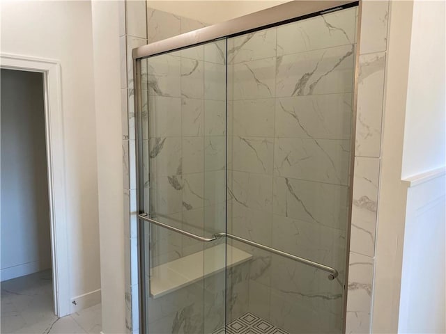 16445 S Elmridge St, Olathe, KS 66062 - bathroom featuring a stall shower, marble finish floor, and baseboards