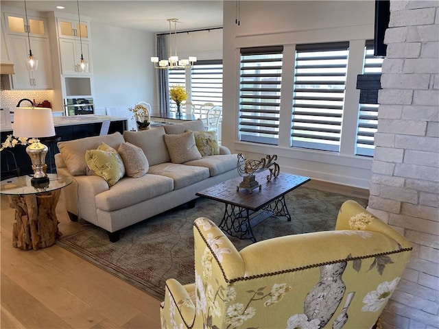 16445 S Elmridge St, Olathe, KS 66062 - living area with a chandelier and wood finished floors