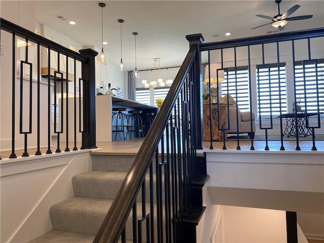 16445 S Elmridge St, Olathe, KS 66062 - staircase featuring visible vents, recessed lighting, and ceiling fan with notable chandelier