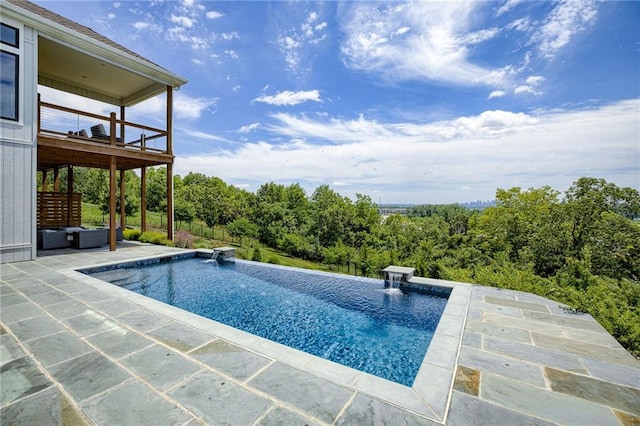 view of pool with a diving board and a patio area