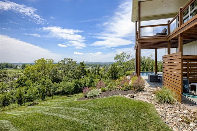 view of yard with a balcony