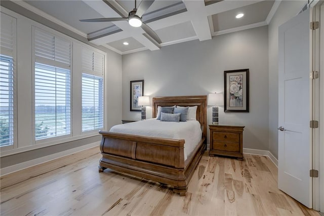 bedroom with beam ceiling, light wood-type flooring, and coffered ceiling