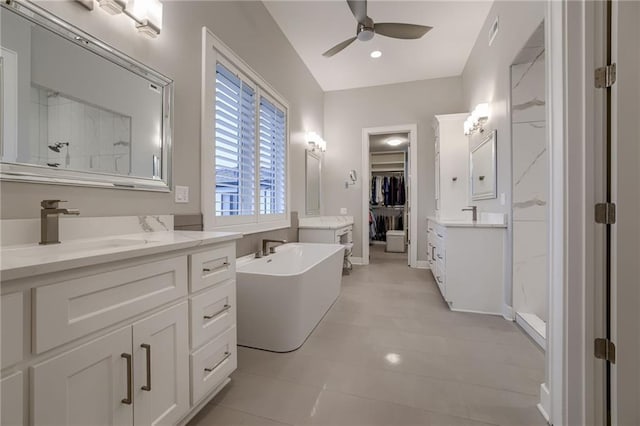 bathroom with vanity, shower with separate bathtub, and ceiling fan