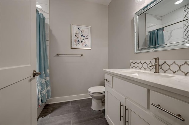 bathroom featuring toilet and vanity