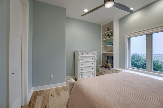 bedroom featuring ceiling fan and light hardwood / wood-style flooring