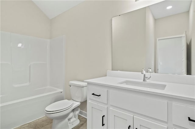 bathroom featuring baseboards, toilet, vanity, shower / washtub combination, and recessed lighting