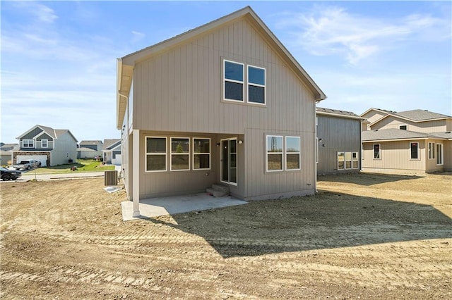 back of house featuring entry steps, a patio, and central AC unit