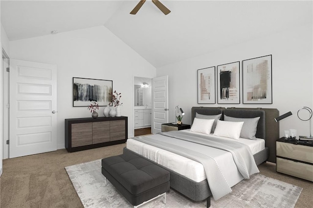 bedroom with ceiling fan, high vaulted ceiling, ensuite bathroom, and light carpet