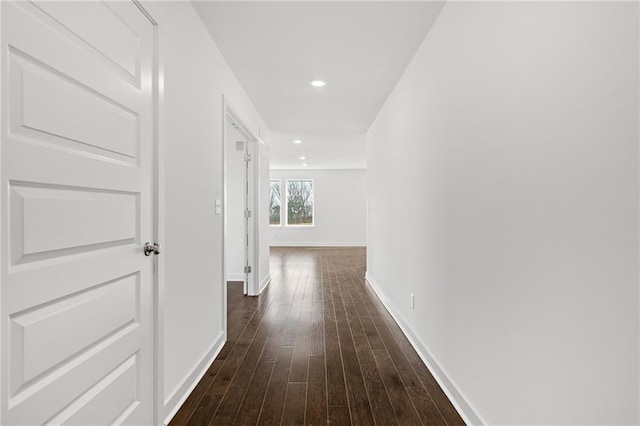 hallway featuring dark hardwood / wood-style flooring