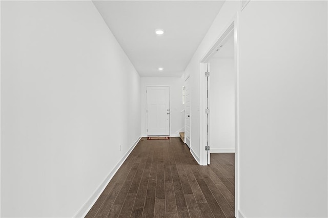 corridor with dark hardwood / wood-style floors