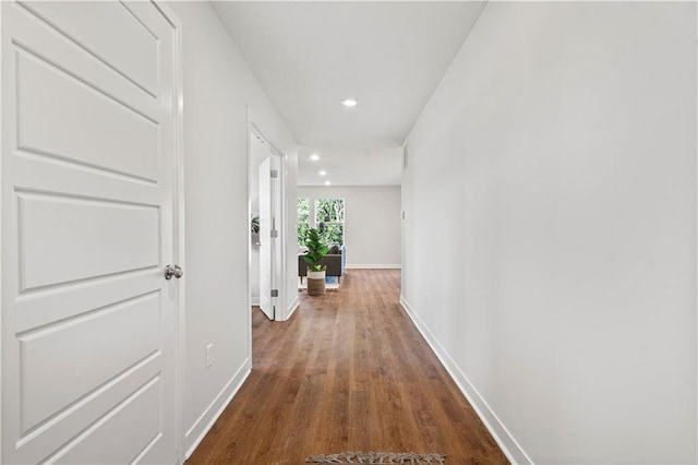 408 Woodview Dr, Raymore, MO 64083 - corridor with baseboards, dark wood-style flooring, and recessed lighting