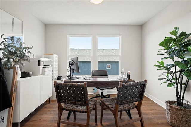 408 Woodview Dr, Raymore, MO 64083 - home office with dark wood finished floors and baseboards