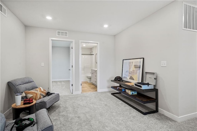 408 Woodview Dr, Raymore, MO 64083 - sitting room with light colored carpet, baseboards, and recessed lighting
