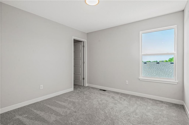 408 Woodview Dr, Raymore, MO 64083 - unfurnished bedroom with baseboards and carpet floors