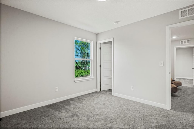 408 Woodview Dr, Raymore, MO 64083 - unfurnished bedroom featuring carpet and baseboards