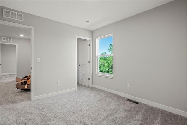 408 Woodview Dr, Raymore, MO 64083 - unfurnished bedroom featuring carpet floors and baseboards