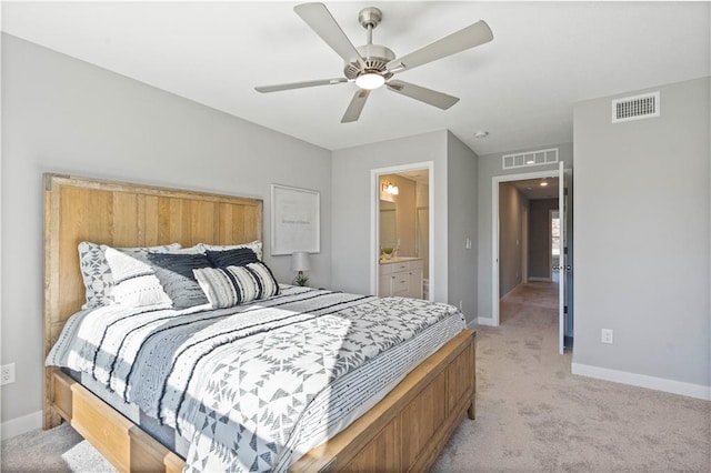 bedroom with light colored carpet, visible vents, and baseboards