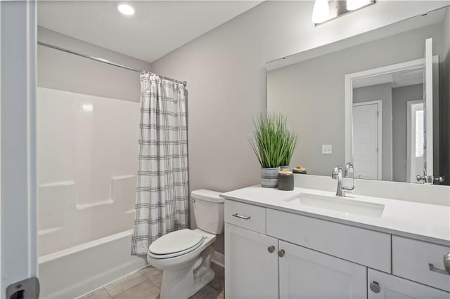 bathroom with vanity, shower / bath combo with shower curtain, toilet, and tile patterned floors