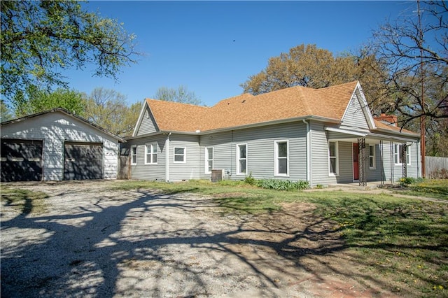 view of front of house featuring a garage and a porch