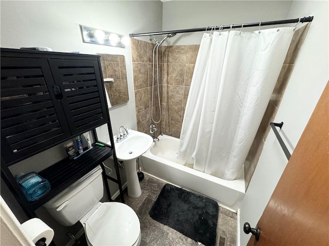 bathroom featuring toilet and shower / tub combo with curtain